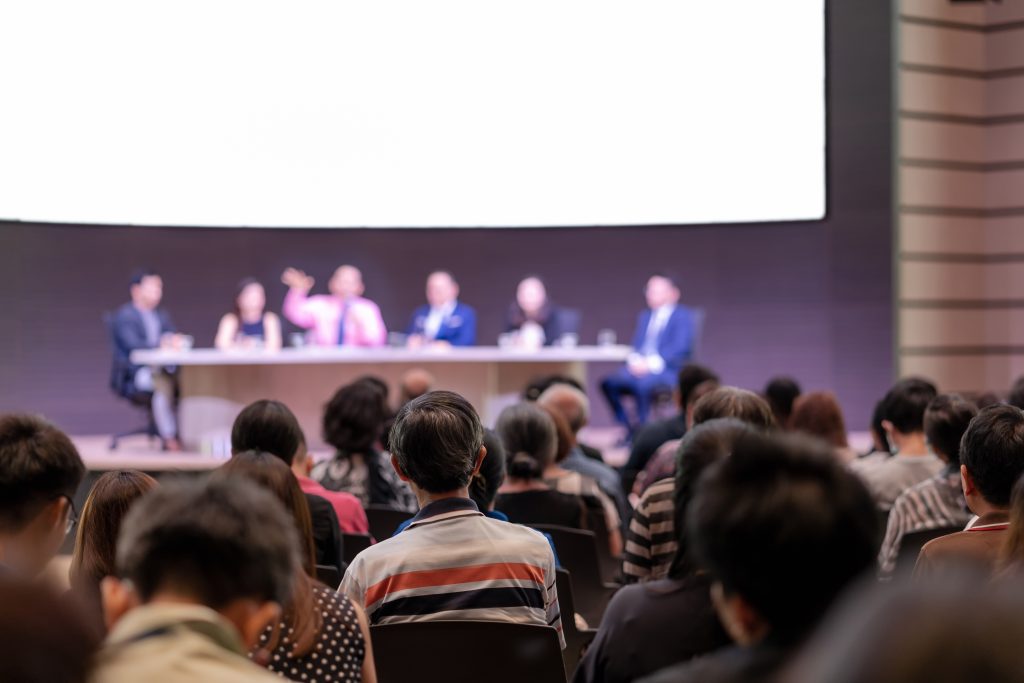Rear view of Audience in the conference hall or seminar meeting